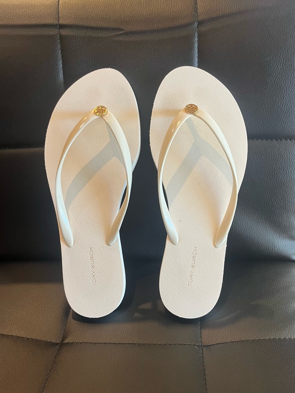 Tory Burch White/Off-White Flip Flops with Gold Logo Medallion